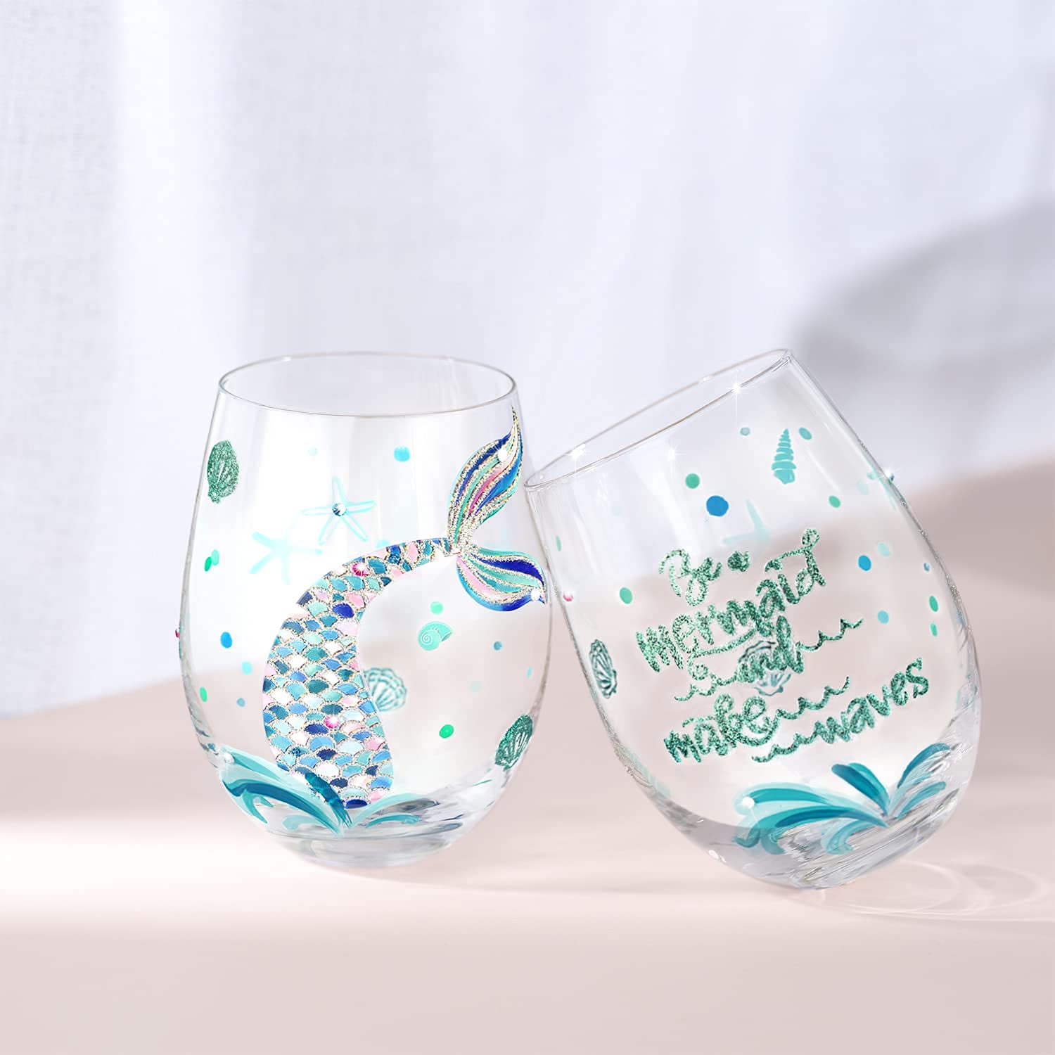 Two-glass set showcases refined hand-painted detail for stylish gatherings.