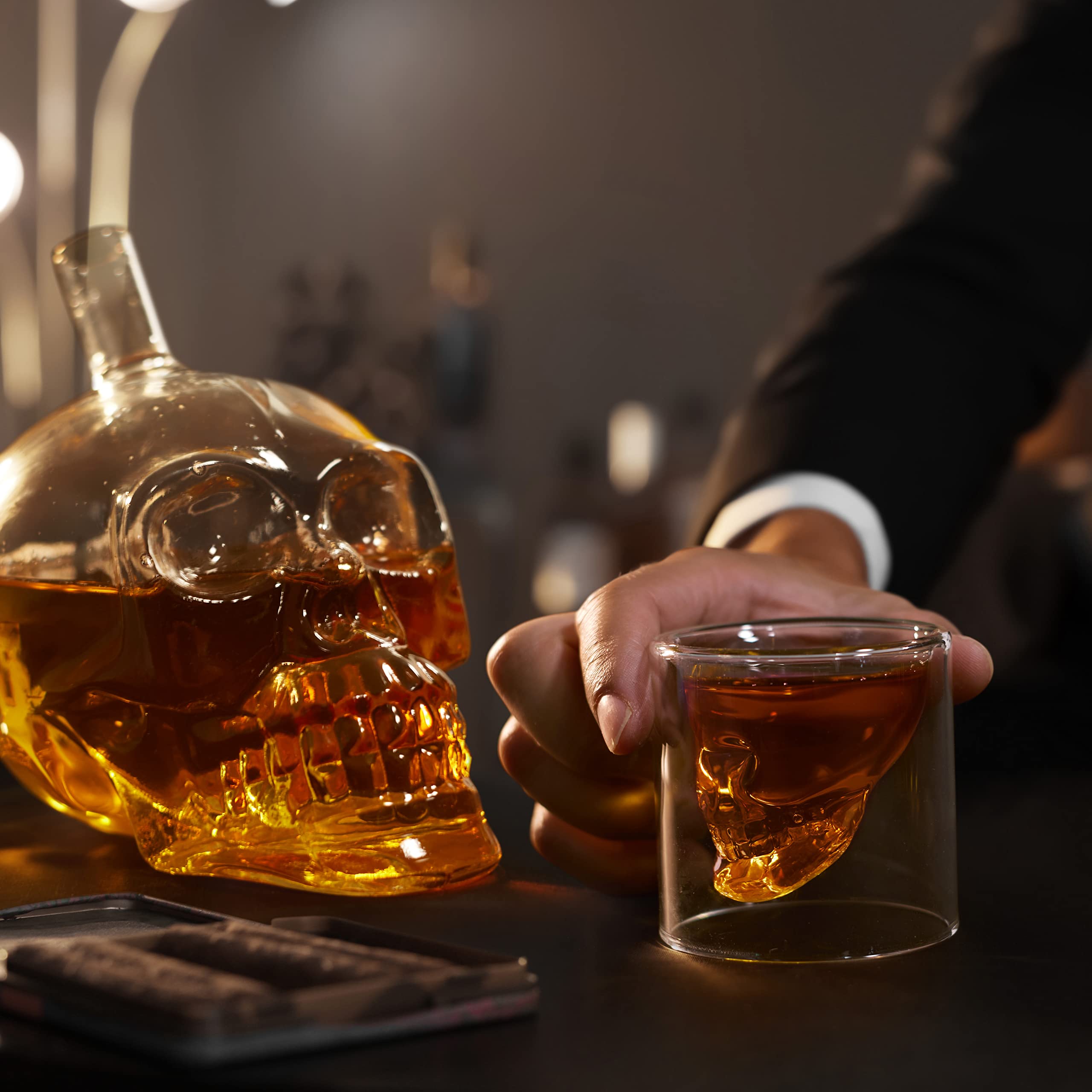 Display-ready skull decanter enhances home bar decor.