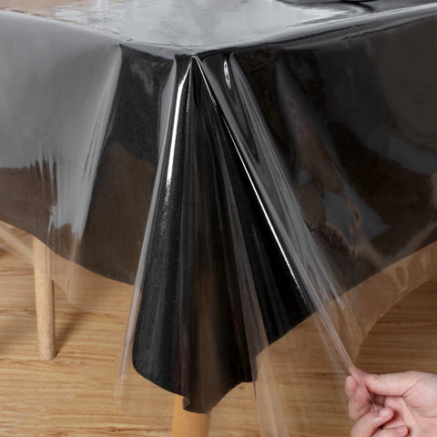 Obstal clear tablecloth on dining table protects surfaces while showcasing natural wood