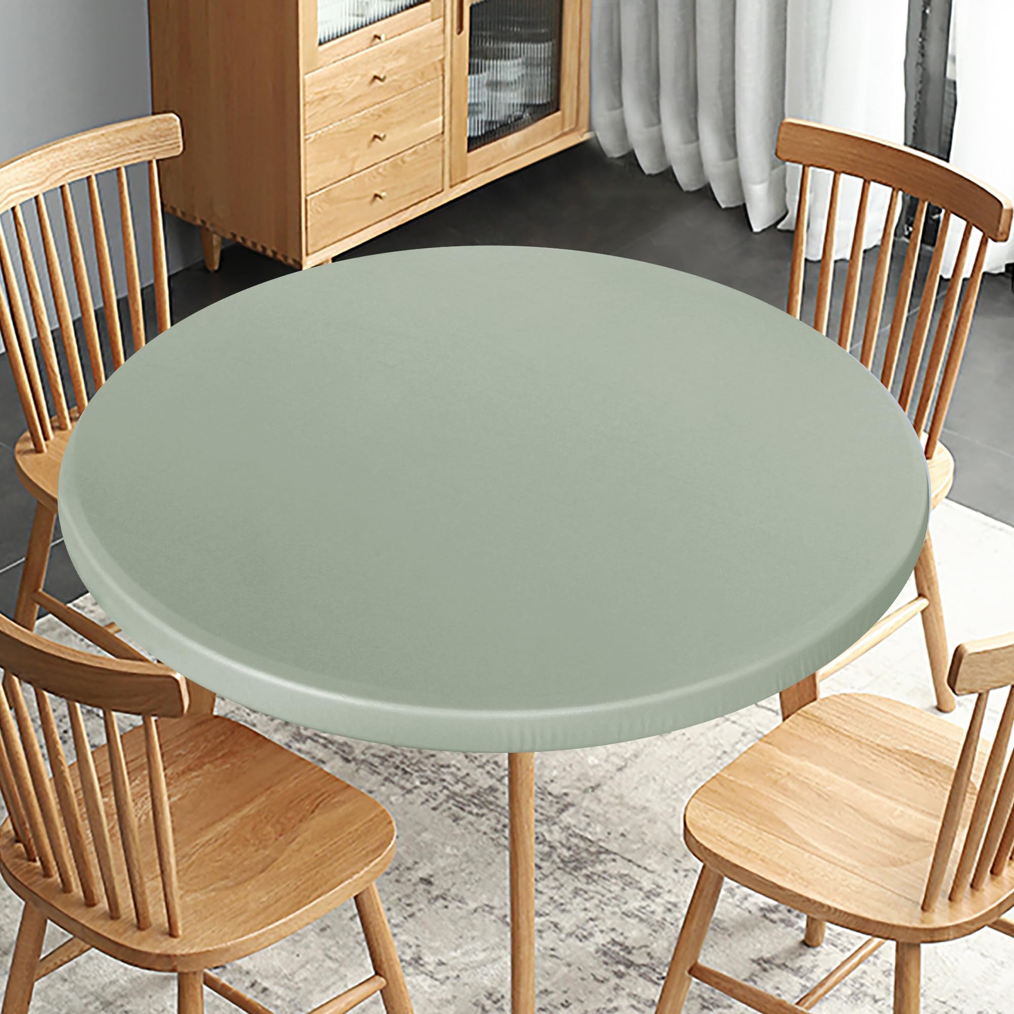 Obstal sage-green table protector creating inviting atmosphere.