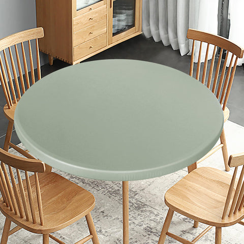 Obstal sage-green table protector creating inviting atmosphere.