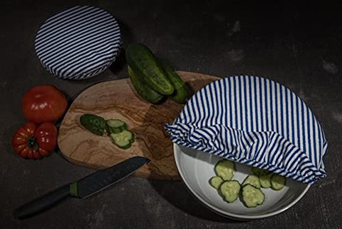 OhBerry small blue striped bowl cover stretches over a small bowl to protect leftovers