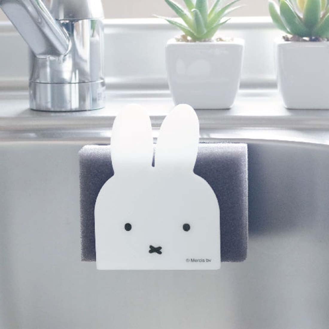 Okato Miffy magnet sponge holder's bottom drainage gaps promote hygienic drying after use.