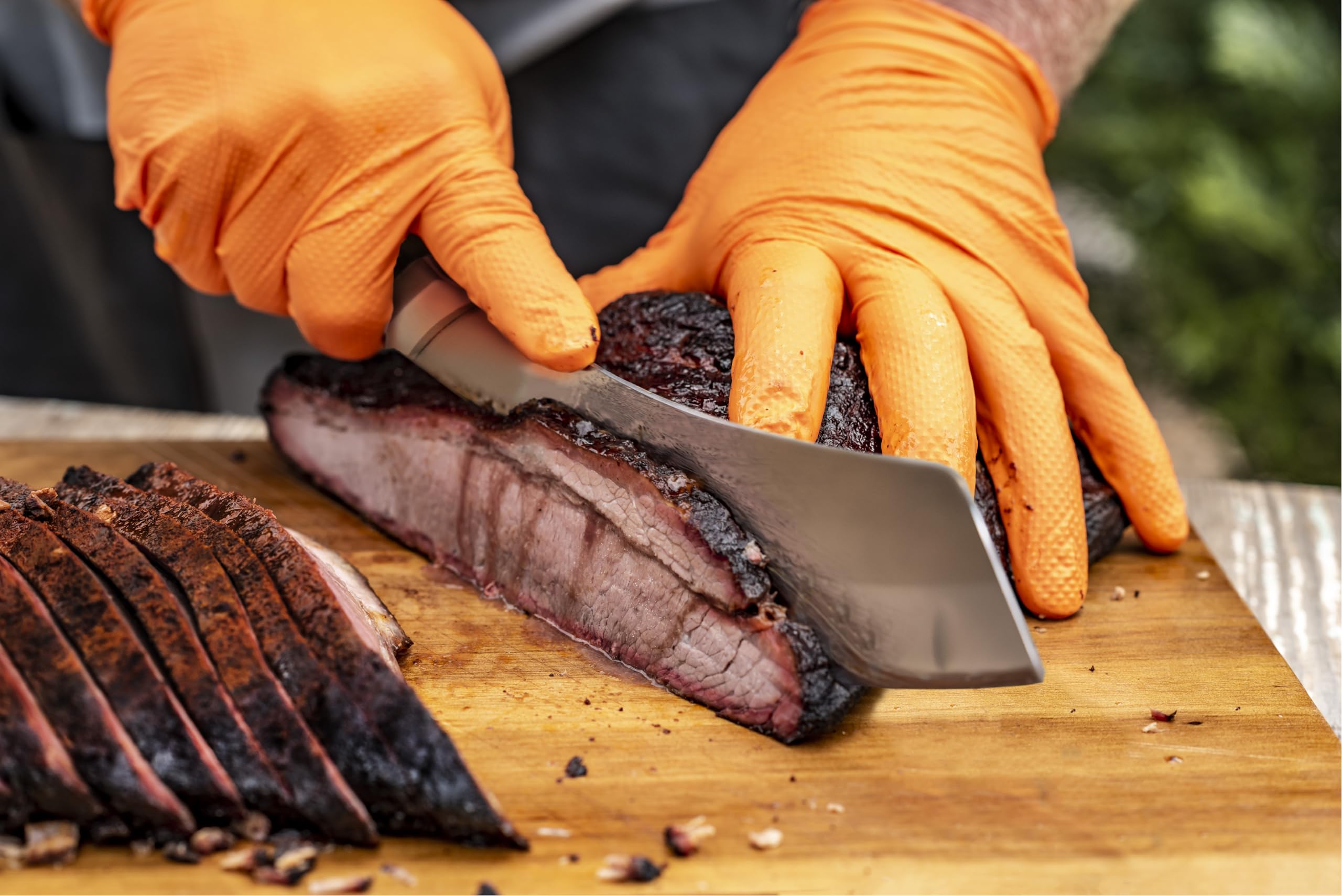 Oklahoma Joe's Blacksmith cleaver chopping vegetables with precision
