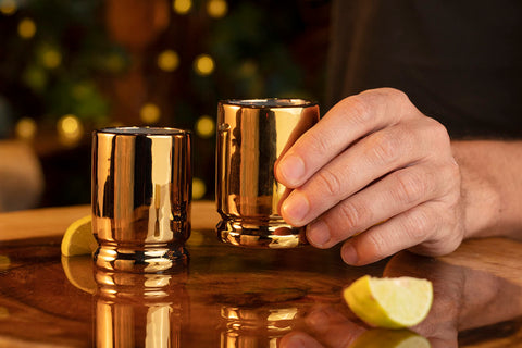Old Southern Brass 2-ounce capacity supports measured pours during games and gatherings.