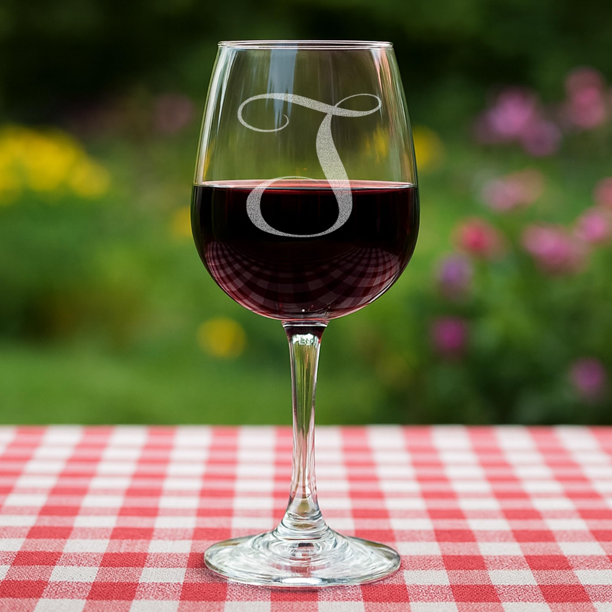 On The Rox Drinks wine glass with initials and elegant stem details.