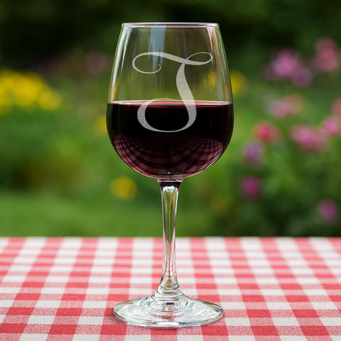 On The Rox Drinks wine glass with initials and elegant stem details.