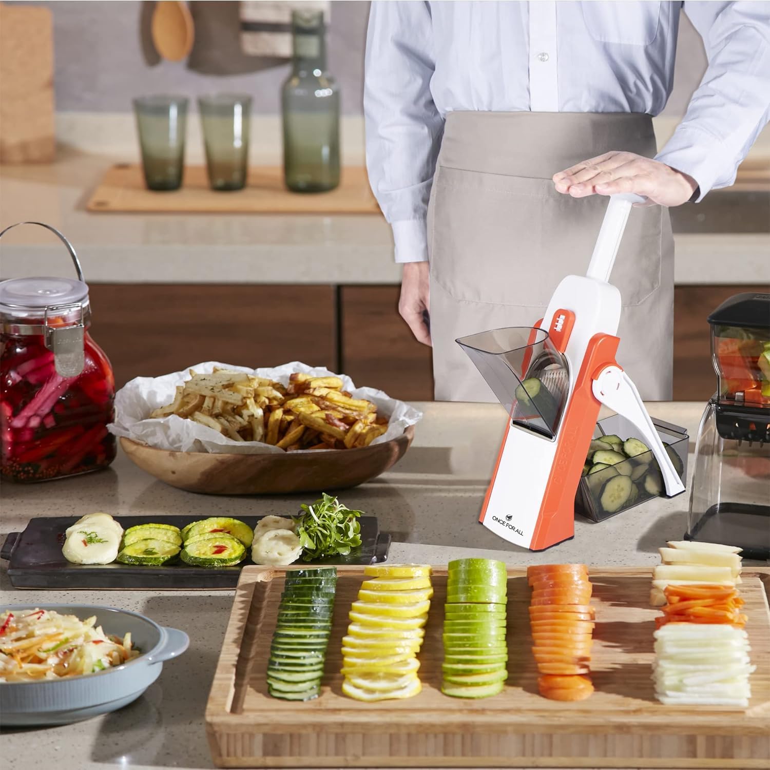 Collapsible orange mandoline slicer design cleans easily with included brush