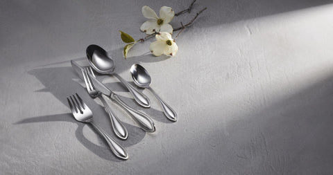 Oneida American Harmony teaspoon in a dishwasher-safe context highlighting rust-resistant stainless steel.