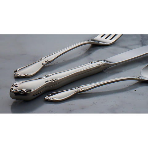Oneida Chateau dinner fork held in hand suggests everyday luxury.