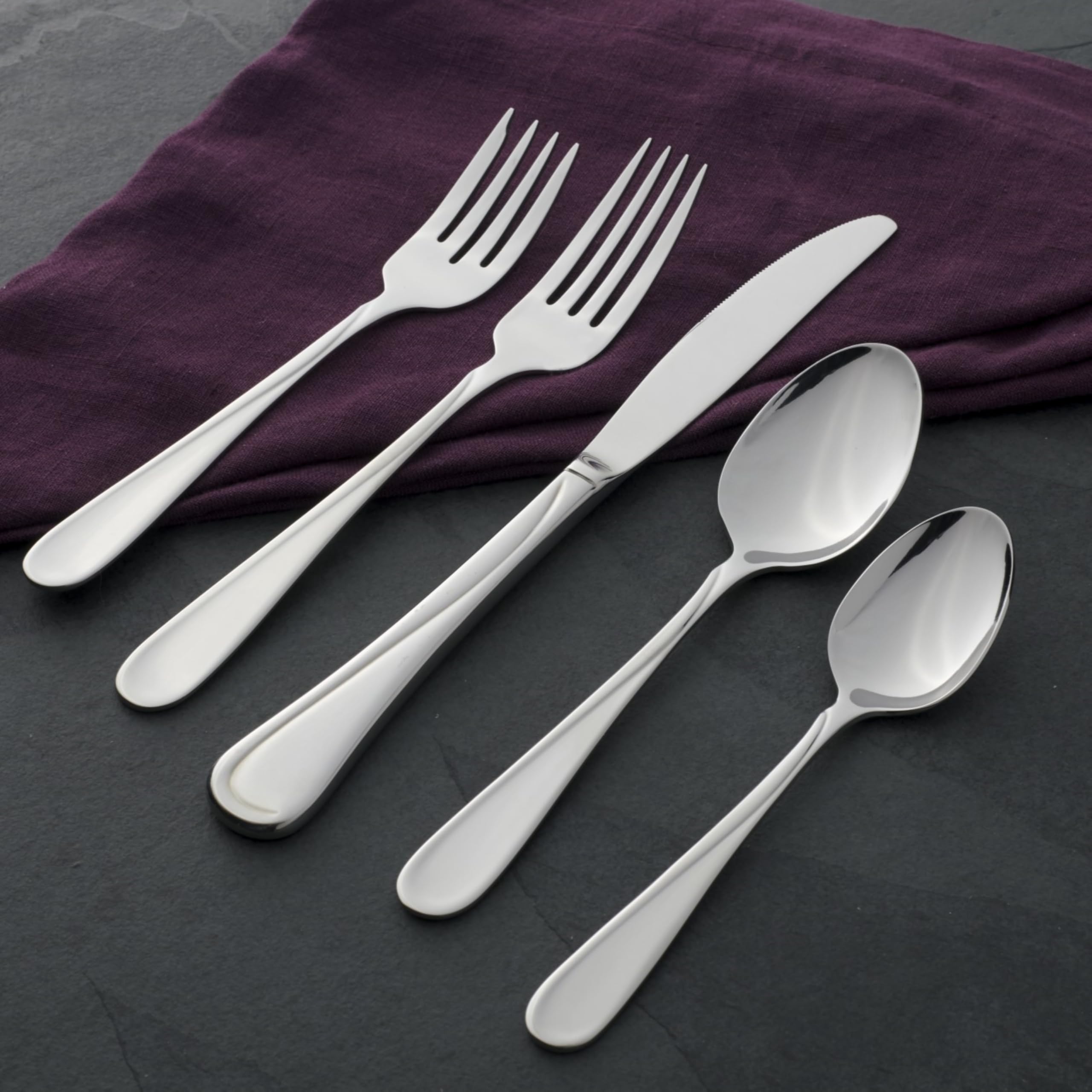 Oneida Flight 18/0 stainless steel emphasizes durability for daily meals.