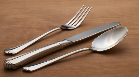 Oneida Juilliard mirror finish captures light for upscale tables.