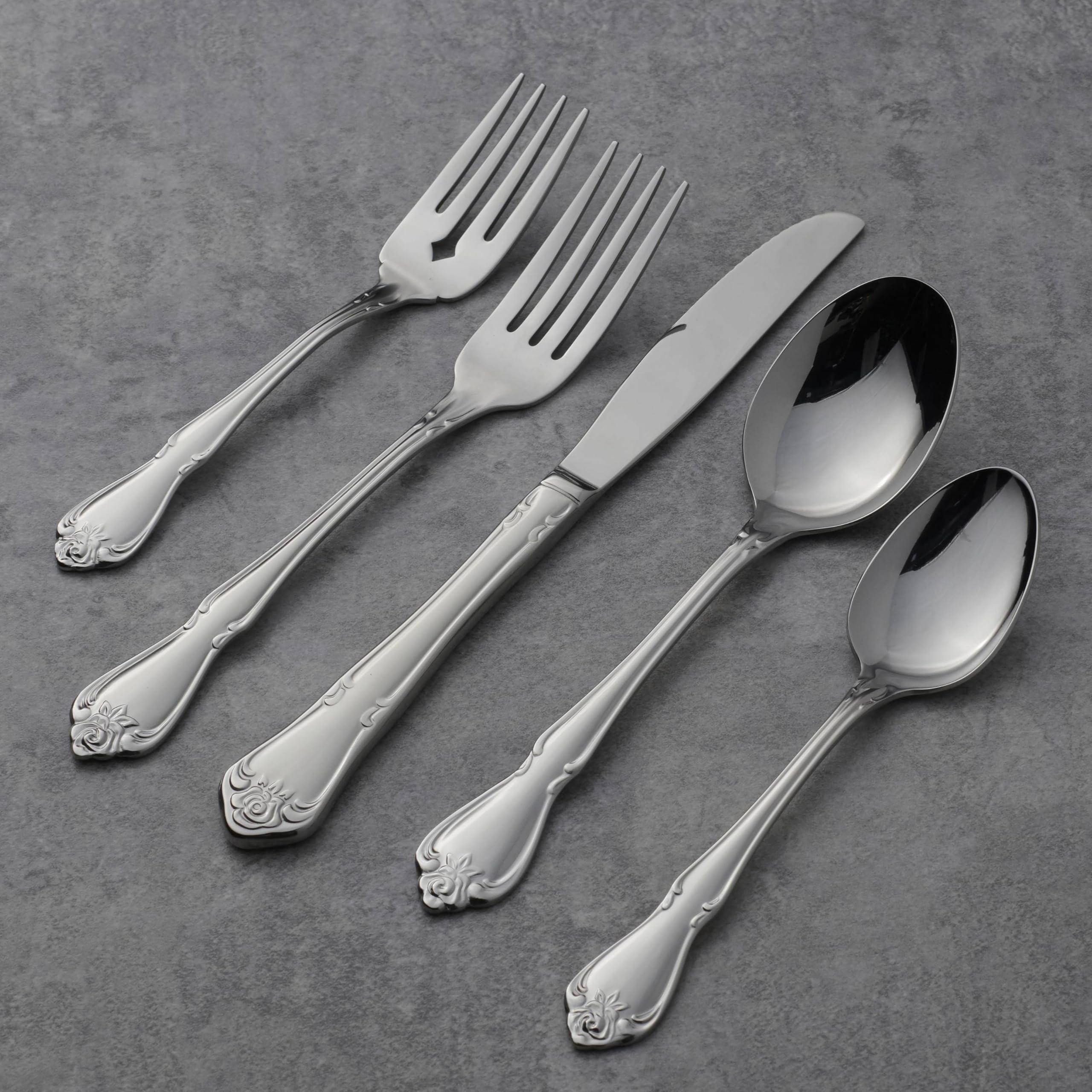 Oneida True Rose teaspoon with mirror finish adds subtle shine to table.