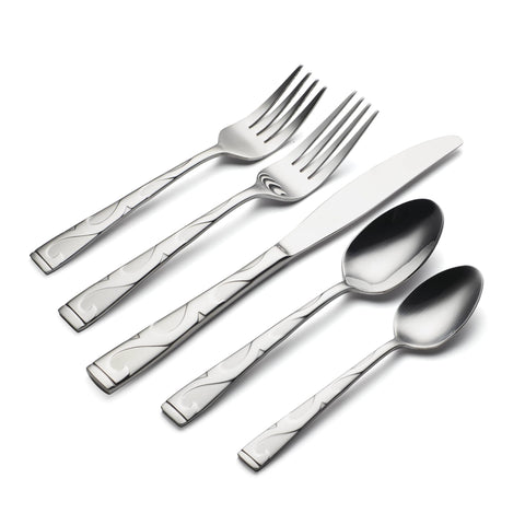 Serving spoons and meat fork from Oneida Tuscany on a table