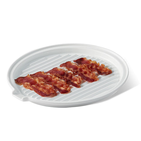 ONEMORE bacon tray close-up shows round ceramic surface ideal for even oven cooking.
