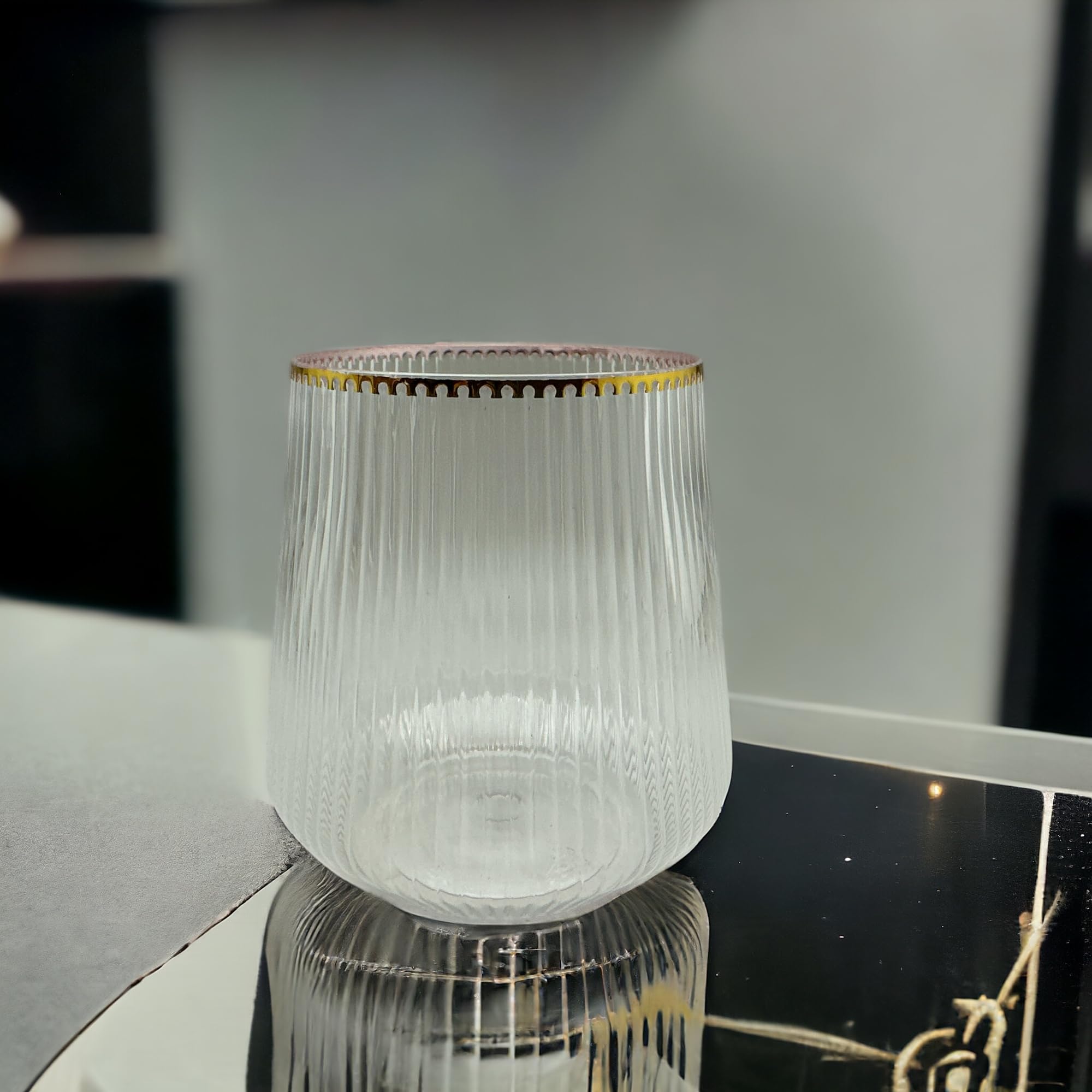 Oojami Ripple Origami glass during indoor dining, combining style and practicality.