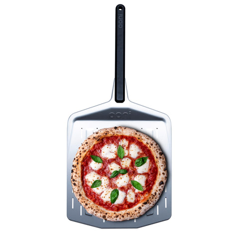 Ooni 14-inch perforated pizza peel front view highlights lightweight prep tool