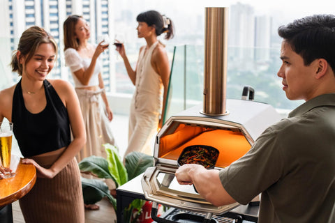 Ooni Grizzler Pan sears a steak with even heat distribution.