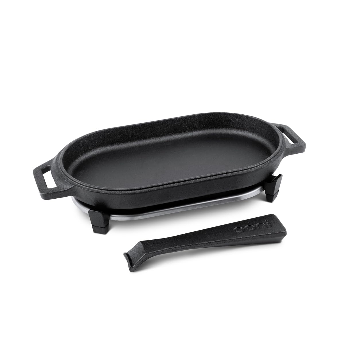 Ooni Cast Iron Sizzler Pan with stainless steel trivet for safe surface protection.