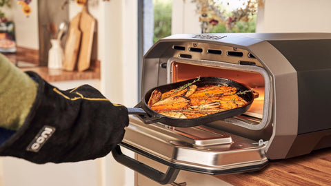 Ooni Cast Iron Sizzler Pan versatile cooktop accessory for ovens.