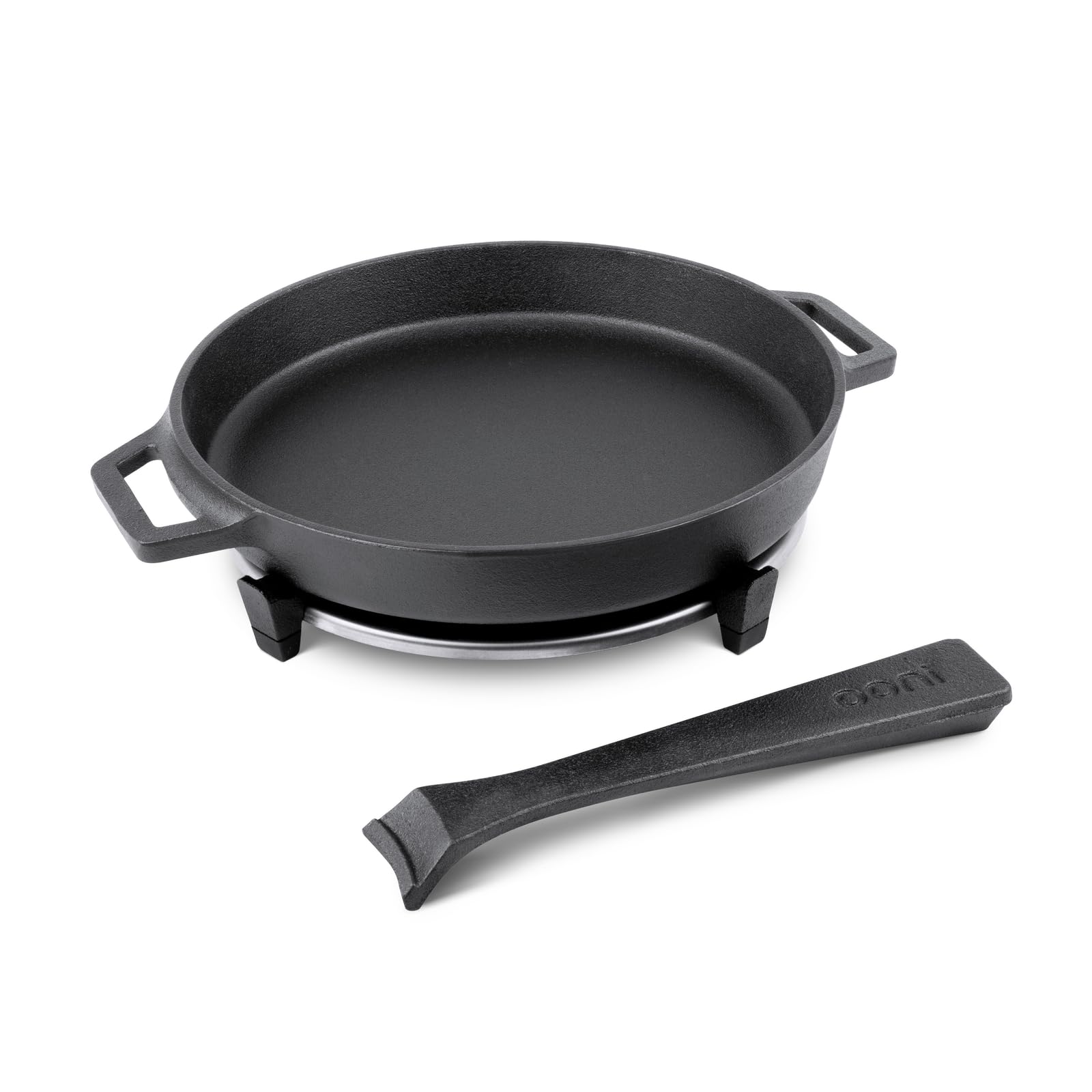 Ooni skillet and included stainless steel trivet protecting surfaces.