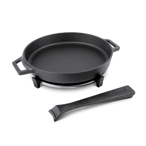 Ooni skillet and included stainless steel trivet protecting surfaces.