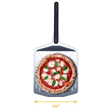 Ooni perforated pizza peel close-up shows perforations for clean launches