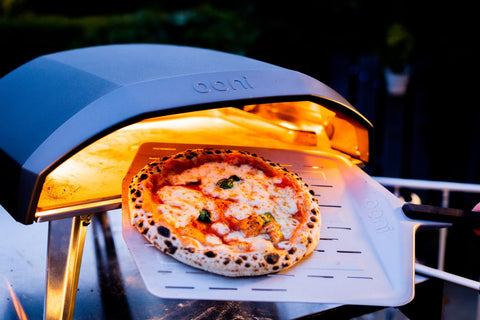 Ooni perforated surface close-up emphasizes steam escape and crisp crust.