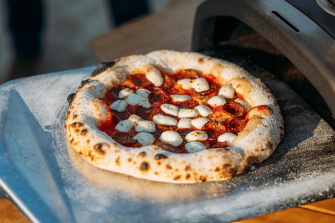 ooni pizza prep tool for stretching dough and adding toppings before baking