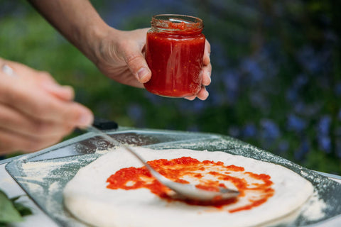 ooni smooth aluminium surface reduces dough sticking for faster pizza assembly