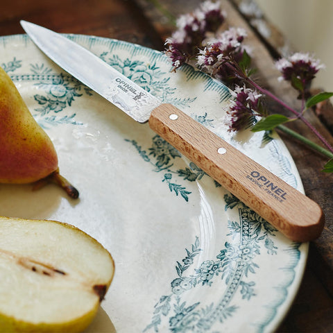 Kitchen scene featuring Opinel No 112 paring knives ready for prep