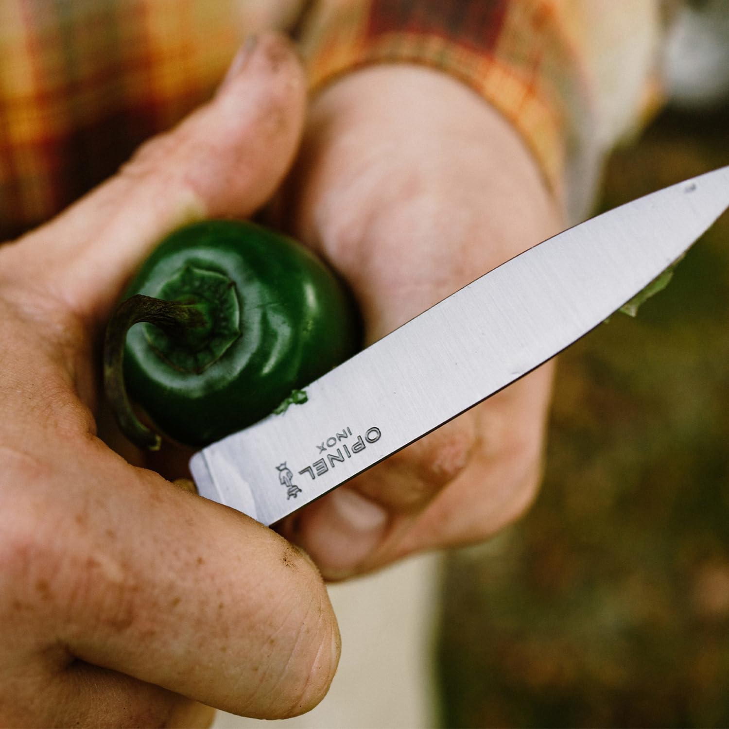 Opinel paring knives stored neatly on a kitchen board