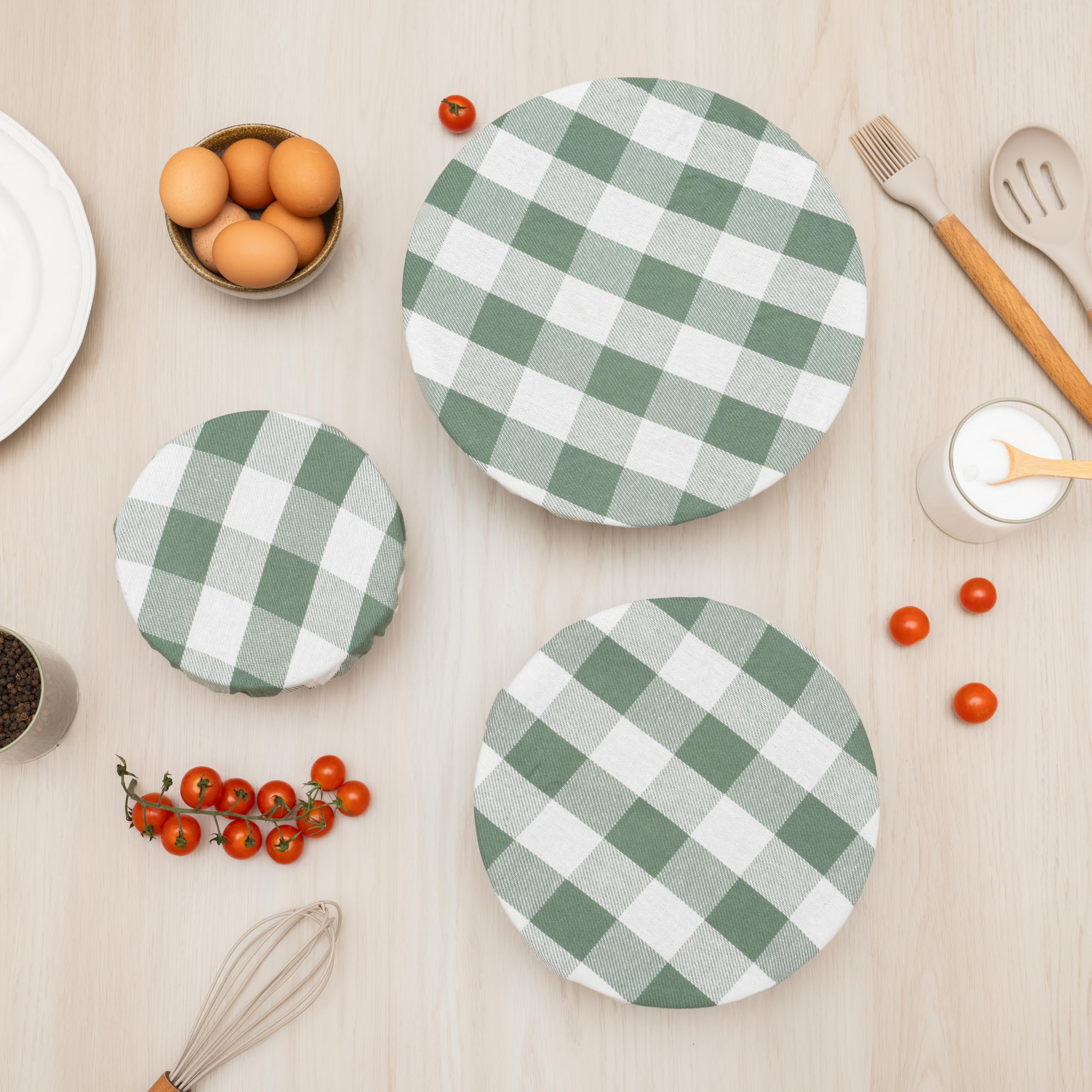 Organic Cotton Mart bread cover in sage-green cloth protects baked goods during cooling.
