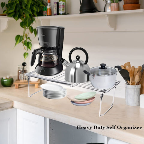 Orgneas expandable shelf installed under-sink for organized storage.