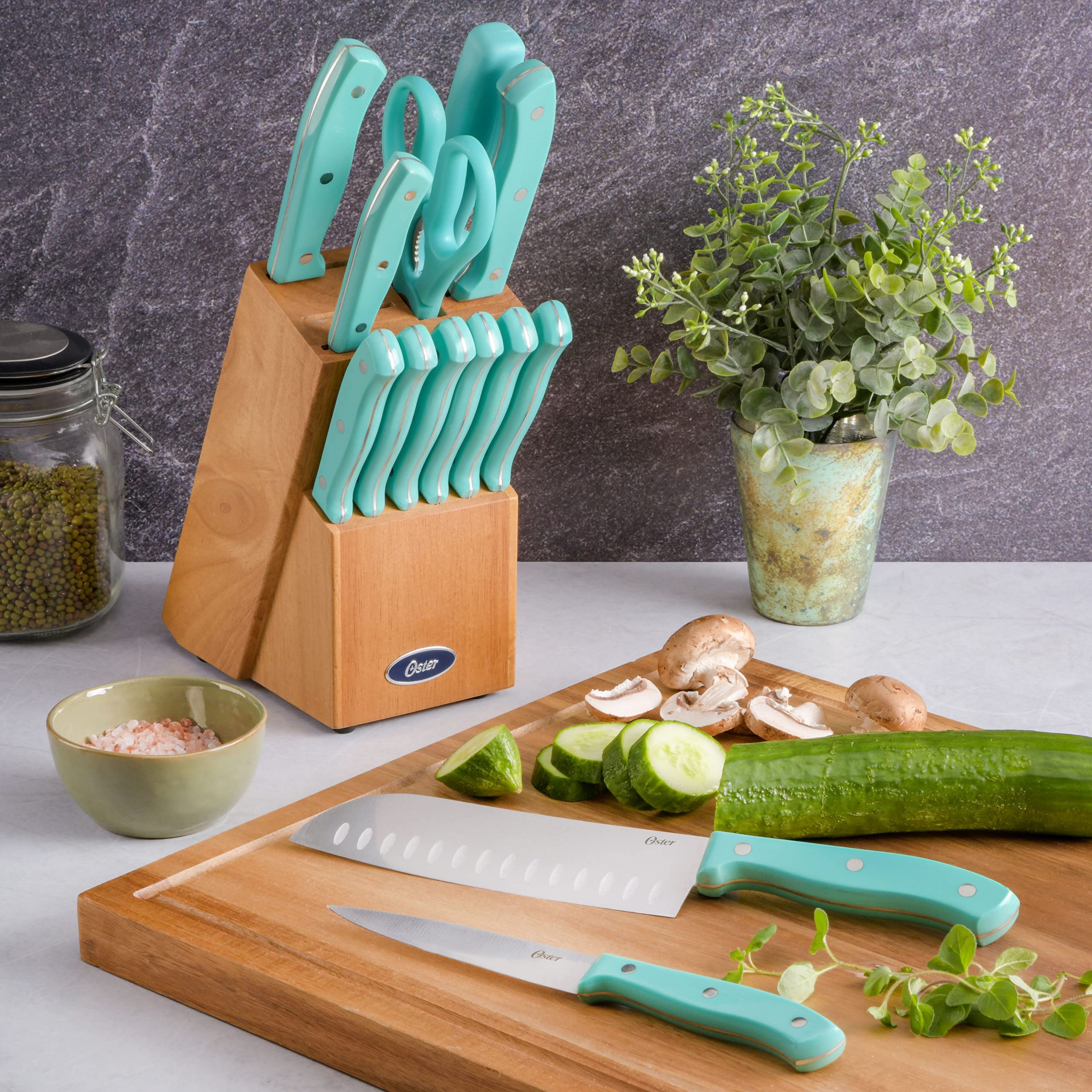 Oster Evansville santoku knife with turquoise handle for versatile prep.