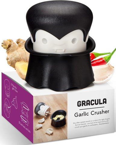 OTOTO Gracula garlic crusher in action, fast minced garlic for meals.