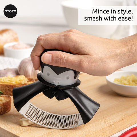 OTOTO Rockula stainless steel body highlights durable garlic pressing tool.