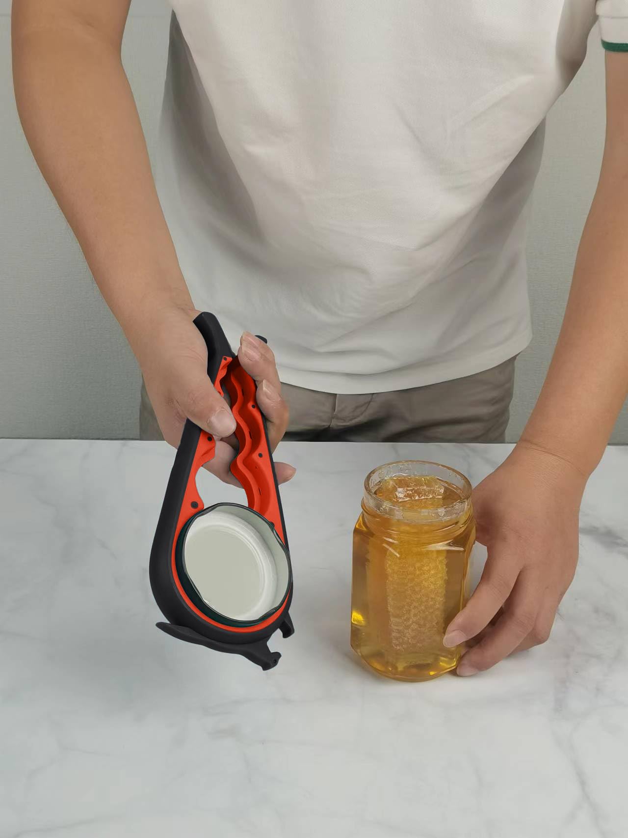 Otstar bottle-opener-lever-action used to loosen tight caps.