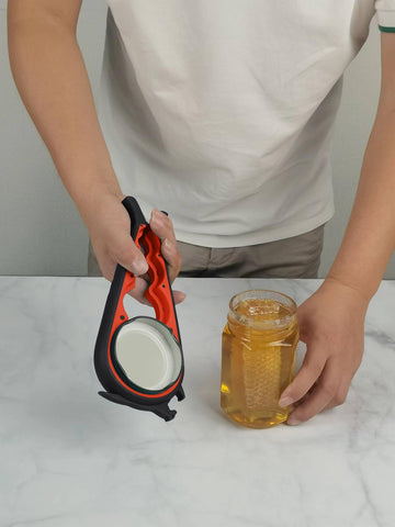 Otstar bottle-opener-lever-action used to loosen tight caps.