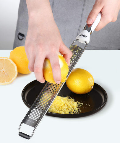 Ourokhome dishwasher-safe zester includes a cleaning brush for easy maintenance.