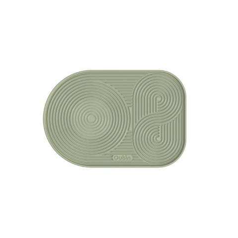 OutIn silicone coffee mat foldable in green protects counters during brewing.