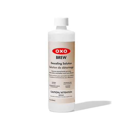 OXO Brew descaling bottle 14oz for cleaning coffee makers and kettles, prolonging appliance life.