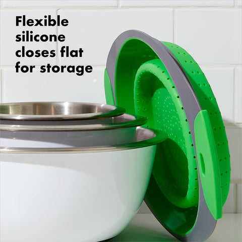 OXO green collapsible colander, heat-resistant silicone for pasta.