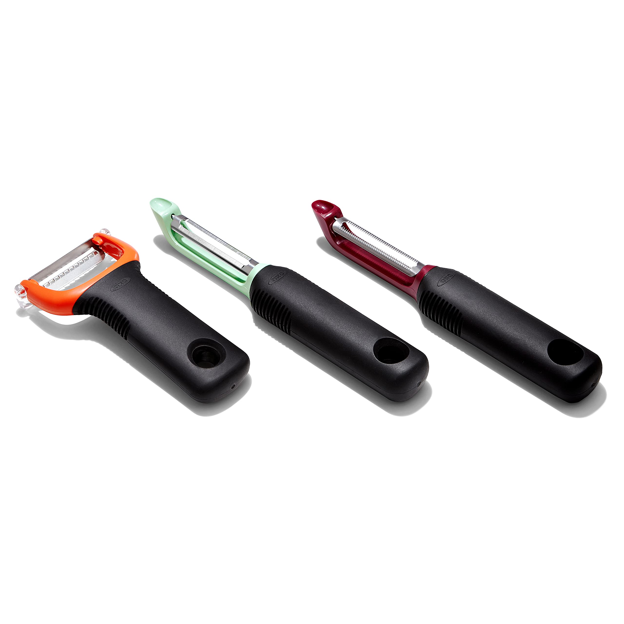 OXO Good Grips 3-Piece Peeler Set on the counter for versatile kitchen prep.
