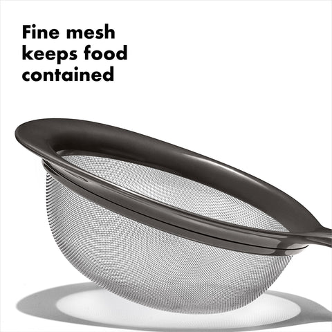 OXO Good Grips 8-inch fine-mesh strainer draining pasta smoothly.