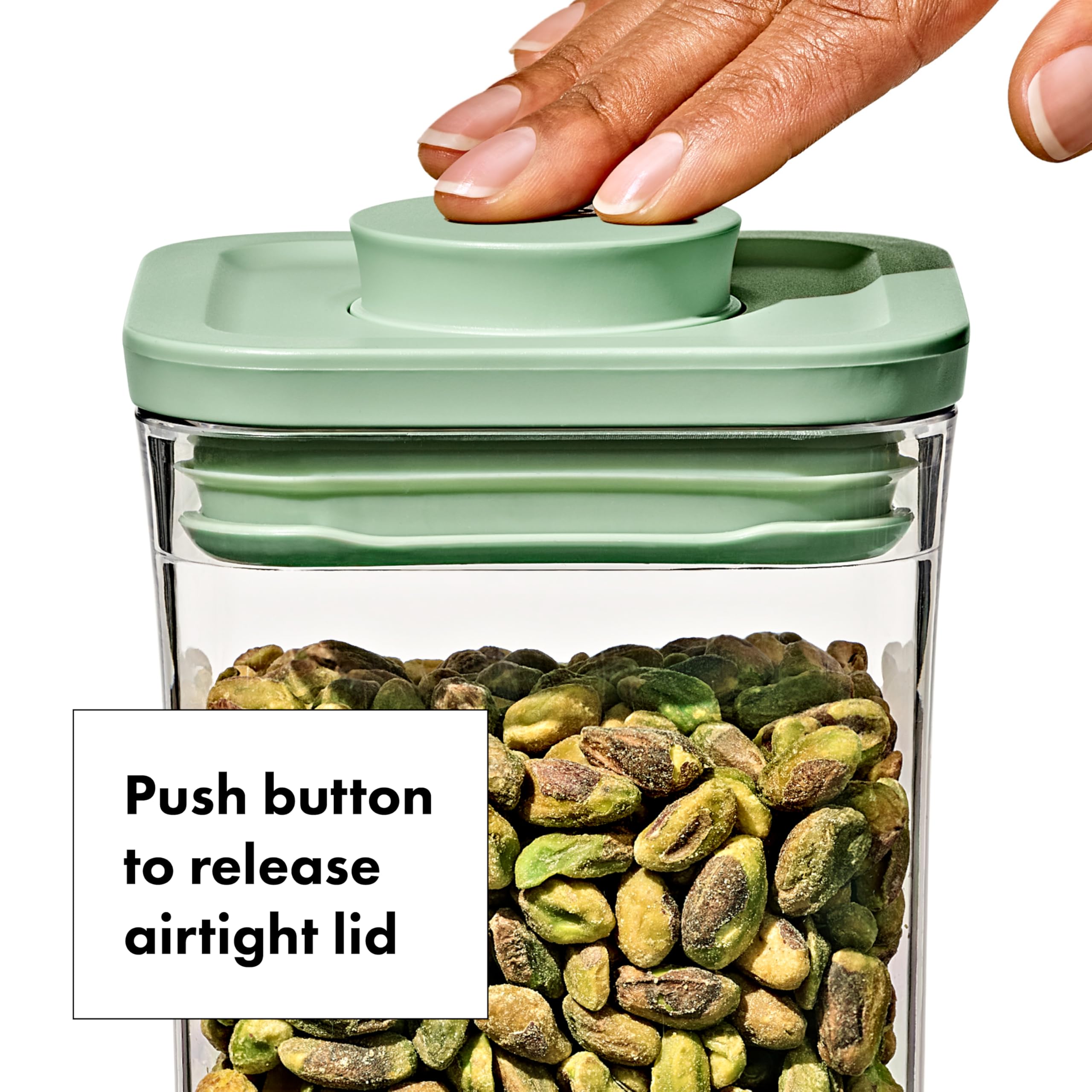 Airtight push-button lid on OXO Good Grips container for fresh storage.