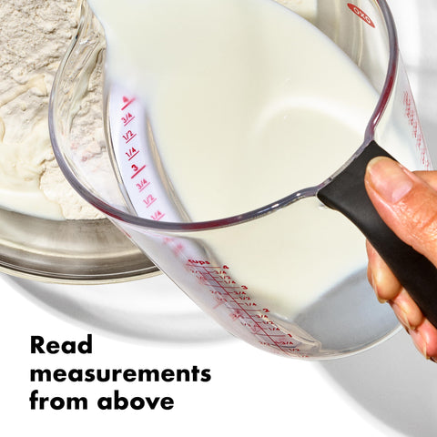 OXO Good Grips angled 2-cup measuring cup reads ounces and milliliters without bending.