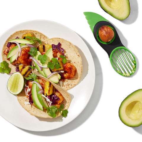 OXO Good Grips avocado slicer in-use-slicing-avocado demonstration.