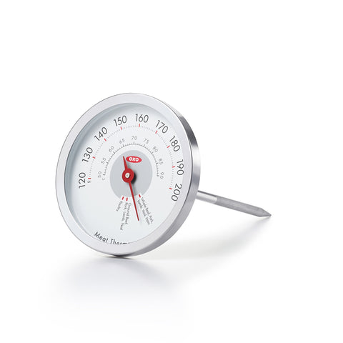 OXO Good Grips Chef's Precision analog thermometer in meat for steady, accurate cooking readings.