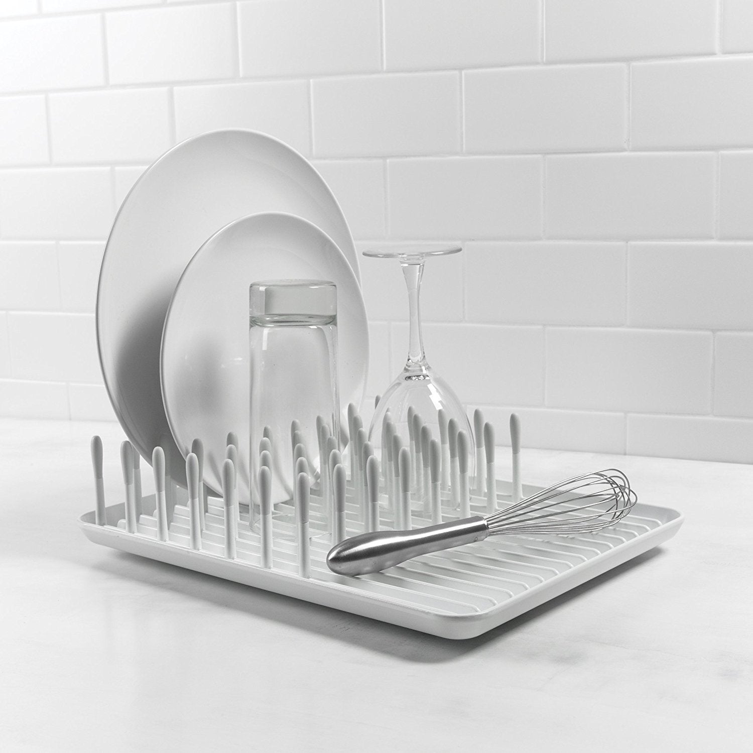 OXO Good Grips compact dish rack in-use on countertop for plate drying